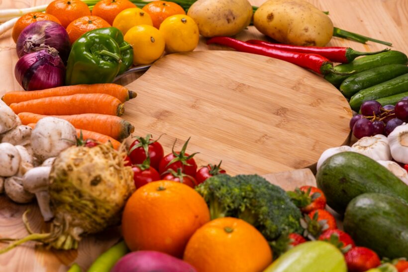 orange and green vegetables on brown wooden table